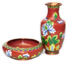 A Chinese iron red ground cloisonne enamel vase, of baluster form, decorated with blue flowers withi