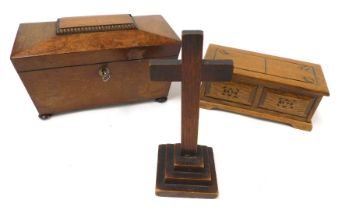 A Regency mahogany sarcophagus tea caddy, raised on bun feet, with key, 22.5cm wide, (AF), together
