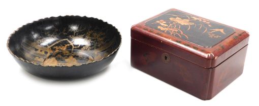 An early 20thC Japanese red lacquer box, of rectangular section, the hinged lid decorated in relief