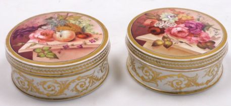 A pair of early 19thC porcelain inkwells, possibly Bloor Derby, by Thomas Steel, painted to the lids