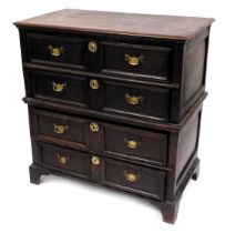 A 17thC oak chest of four long drawers, raised on later bracket feet, 100cm high, 94.5cm wide, 51cm