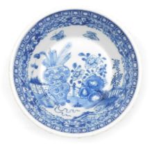 A 19thC Chinese blue and white porcelain bowl, with pie crust rim, decorated with a vase containing