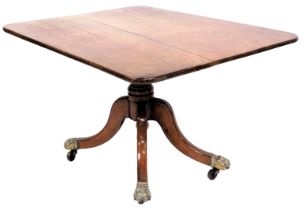 A Georgian oak tilt top breakfast table, the rectangular top raised on a baluster turned column over