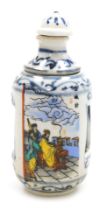 A 20thC Chinese porcelain erotic snuff bottle, of cylindrical form, with a revolving top and inner s