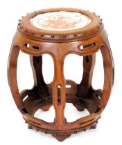 A Chinese hardwood and porcelain stool, of open, barrel form, the top set with a circular panel deco