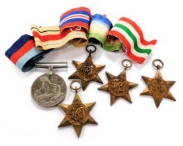 A group of WWII medals, comprising The Africa Star, Italy Star, Atlantic Star, 1939-1945 Star and Th