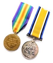 Two WWI medals, named to Pte. E Revill, Nottinghamshire and Derbyshire Regiment, 66819, comprising G