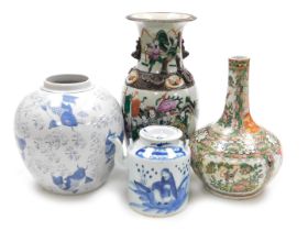 A Qing Dynasty 19thC Cantonese famille rose porcelain bottle vase, decorated with reserves of figure