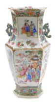 A 19thC Qing dynasty Cantonese porcelain famille rose vase, of twin handled, hexagonal form, decorat