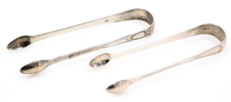 Two pairs of Georgian silver sugar tongs, with bright cut engraving, 2.09oz.