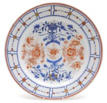 A Kangxi porcelain Imari charger, painted with flowers, within a panelled and flower head border, ve