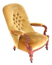 A Victorian mahogany button back nursing chair, upholstered in gold draylon, raised on turned legs,