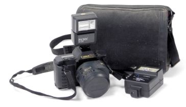 A Canon T80 camera, with electronic flashes, cased.