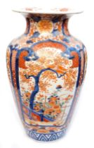 A Meiji period Imari porcelain vase, of shouldered, tapering form, decorated with four panels of vie