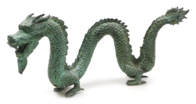 A Chinese verdigris patinated bronze figure of a dragon, 46cm wide.