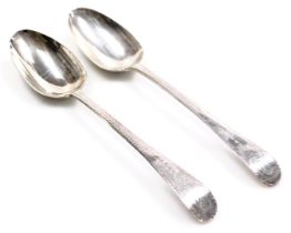 A pair of George III silver table spoons, with bright cut engraving, oval reserve monogram engraved,