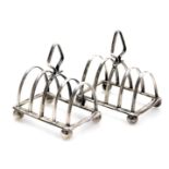 A pair of George V silver miniature four division toast racks, George Adie, Birmingham 1931, 1.36oz.