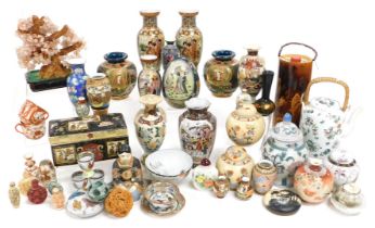 A group of Chinese and Japanese pottery and porcelain, including a pair of Satsuma vases, seated Sat