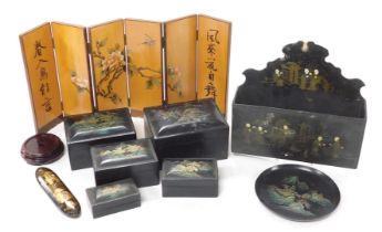 An early 20thC Chinese lacquered spectacle case, a wall mounted letter rack, set of graduated lacque