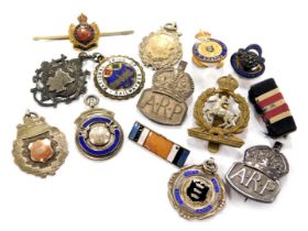 A silver Special Constabulary medallion, four further silver medallions, two silver ARP badges, a Na
