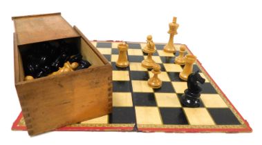 A Staunton type chess set, boxed, queen 92cmm high, and a chess and draughts board. (2)