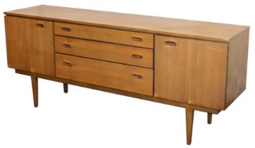 A Nathan teak sideboard, with three central graduated drawers, flanked by a pair of cupboard doors,