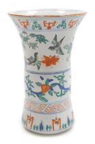 A 20thC Chinese porcelain wucai gu vase, decorated with flowers and scrolling branches, the top band