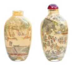 Two Chinese inside painted glass snuff bottles, one painted with figures in a landscape, with stoppe