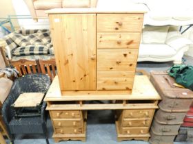 A small pine unit, with door to left hand side and four drawers to right, and a pine kneehole desk,