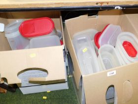 Two boxes containing a large quantity of Tupperware items.