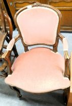A French style open armchair, with pink upholstered seat and back.