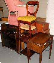 A bookcase, a balloon back dining char, small rattan cupboard, cane stool, occasional two tier table