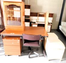 An office desk, office chair, small glazed door cabinet, and a bevel gilt framed mirror. This lot i