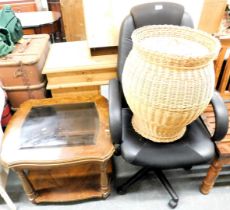 An office chair, a wicker washing basket, and a two tier coffee table.