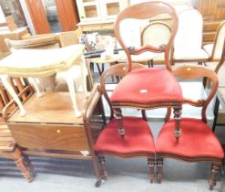 Three Victorian balloon back dining chairs, with red upholstered seats, a footstool, and a tea troll