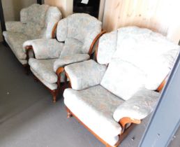 A three piece suite, with wooden frame and floral upholstery, comprising of a two seater settee and