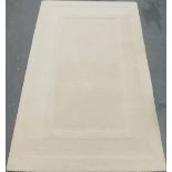 A Dunelm Oslo ivory ground rug with rectangular design to central field. Dimensions are 150cm x 240c