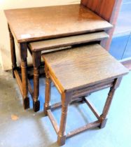 A nest of three oak tables.