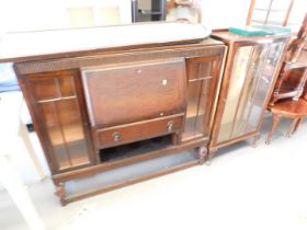 An oak fall front bureau, the fall above single drawer flanked by two panelled doors with undertier,