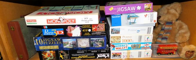 A selection of games and soft toys. (1 shelf)