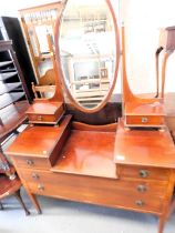 An Edwardian mahogany dressing chest, with oval bevelled mirror to top. This lot is located at our a