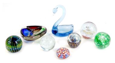 A group of glass paperweights, including Mdina glass dish modelled as a swan, and a Murano tricolour