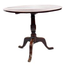A George III oak circular tilt top table, on tripod base, 70cm high, 86cm diameter. (AF)
