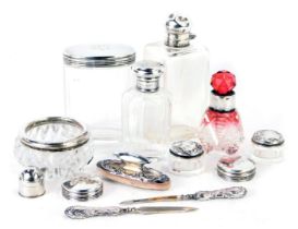 A group of silver topped dressing table jars, comprising a cut and cranberry glass silver rimmed sce