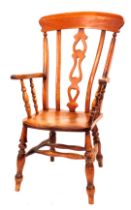 A stained beech lath back chair, with an arched cresting rail and pierced splat, with turned legs,