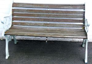 A bench, with cast metal ends and slatted seat and back, 129cm wide.