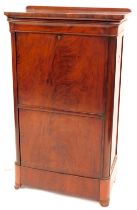 A 19thC Biedermier style flame figured mahogany secretaire a abbatant, with rounded top and corners