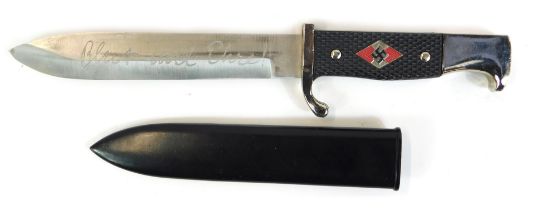 A replica Third Reich dagger, with stainless steel blade, and a black plastic moulded handle, the bl