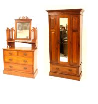 An Edwardian walnut bedroom suite, comprising single hanging wardrobe, enclosed by a single mirrored