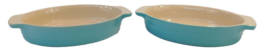 Two Le Creuset pale blue ovenware dishes, comprising 13-20 and 15-31, 29cm wide. (2)